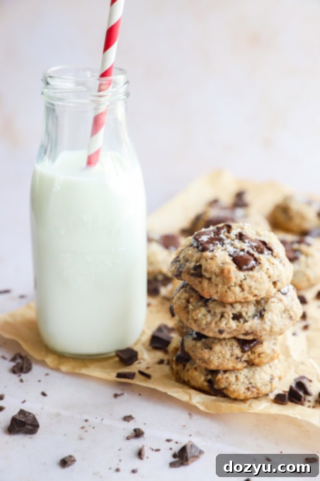 stack of chewy baked treats for the holidays with carafe of milk with straw