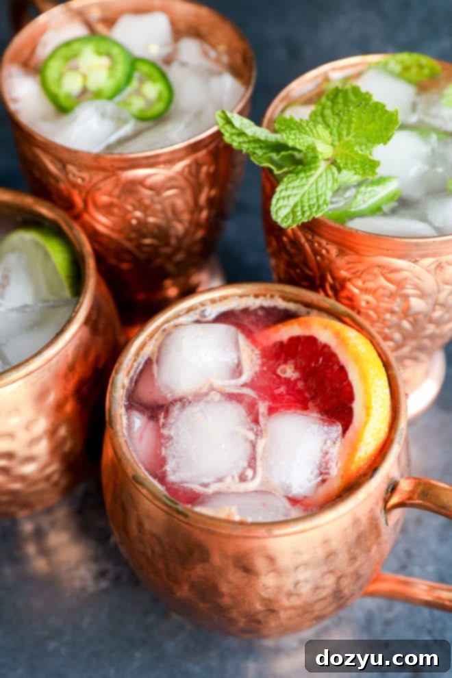 variations of non-alcoholic drinks with fresh herbs and fruits in copper mugs