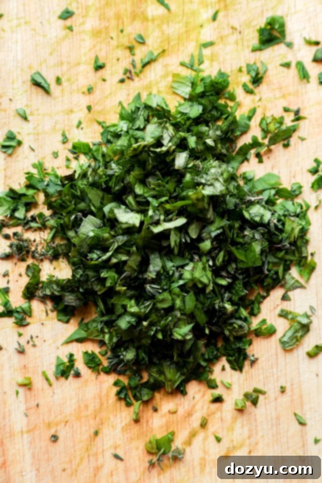 freshly chopped herbs on cutting board
