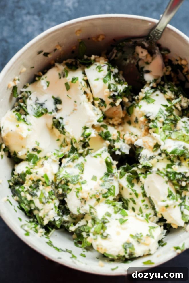 garlic herb butter being made in a bowl