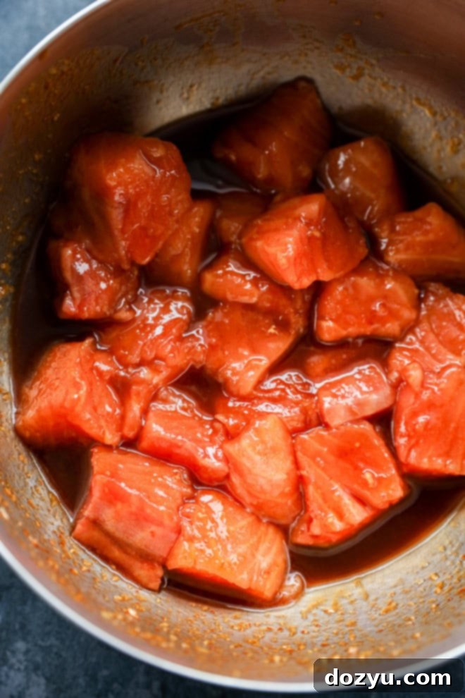 salmon bites in bowl with marinade