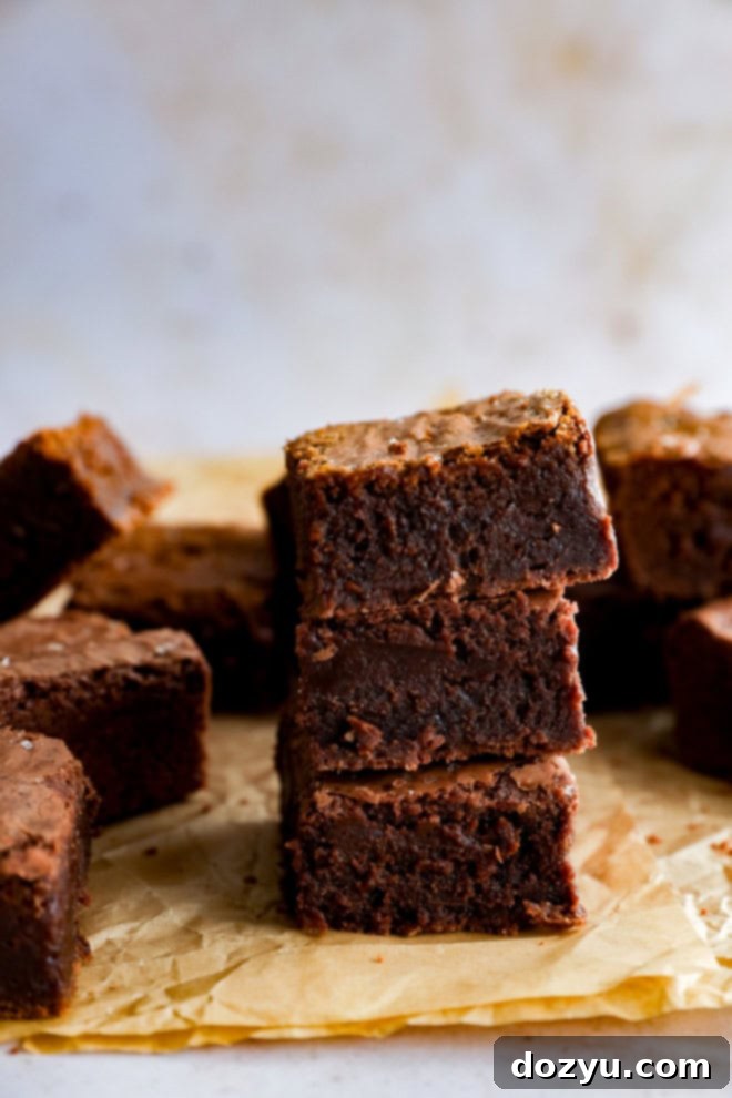 stack of chocolate baked treats on parchment paper
