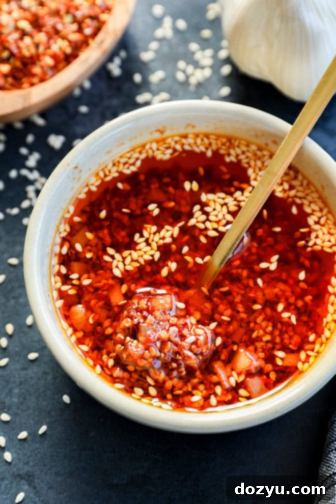 spoon in bowl of chili garlic oil recipe