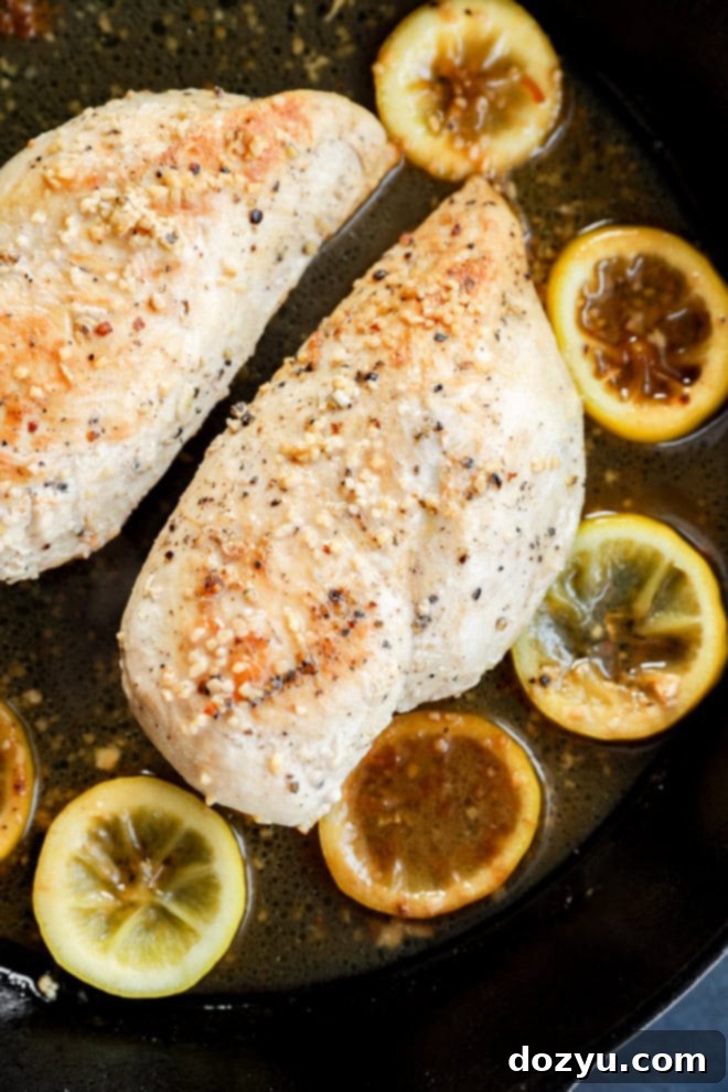 chicken breasts in cast iron skillet with citrus slices