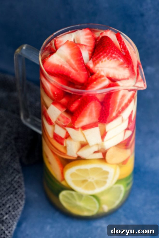 making White sangria in a pitcher