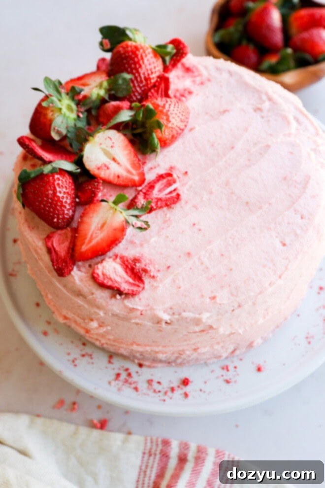 pink berry cake with fresh fruit frosting and center