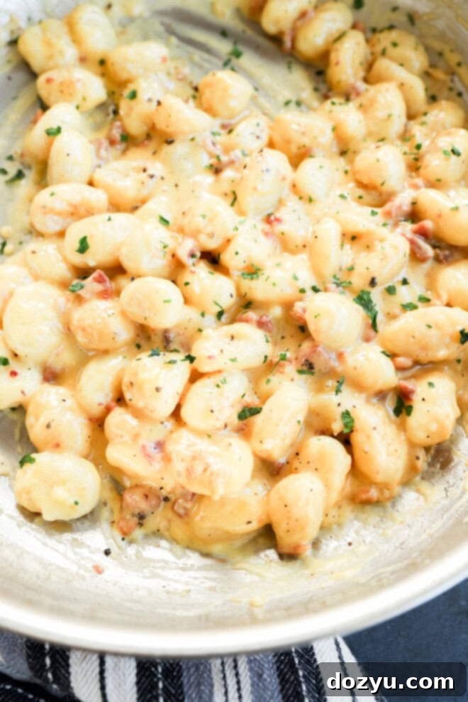 Easy italian pasta recipe with cheese sauce and pancetta in a bowl