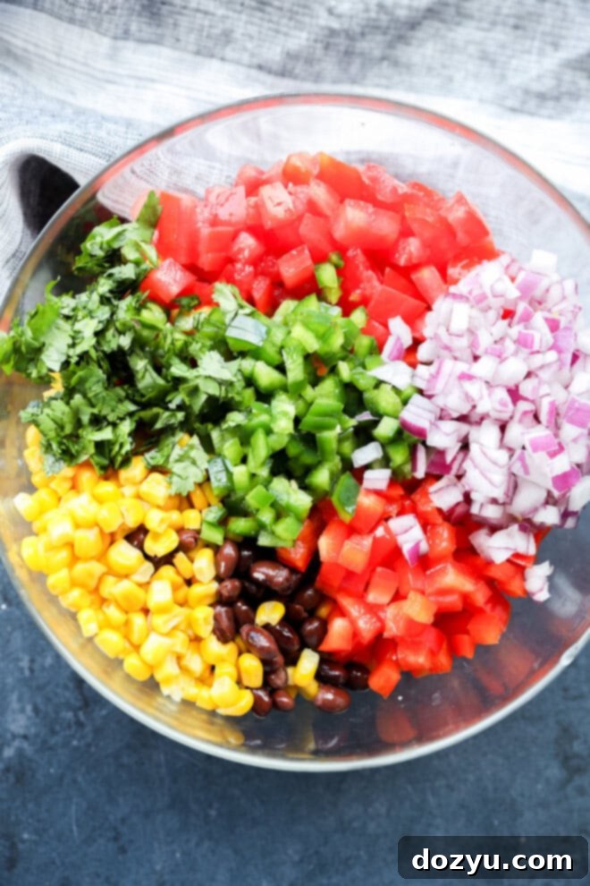Southwestern Black Bean Corn Salsa Dip 4 making Black bean corn salsa dip in a bowl