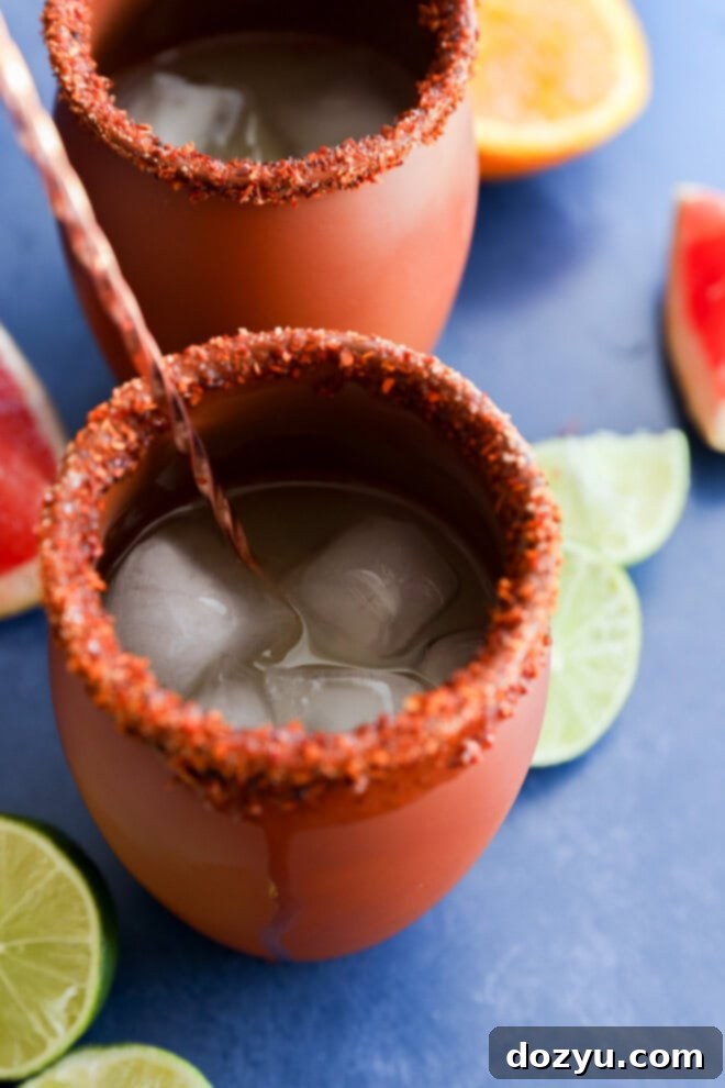 Stirring a Cantarito in a clay glass