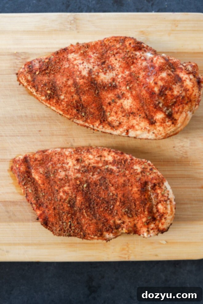 Cooked chicken pieces seasoned with a spicy, smoky blend, ready to be served, illustrating a use of the spice mix