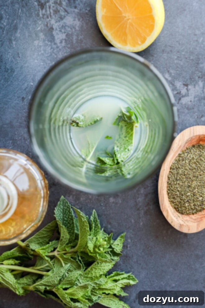 Muddled mint leaves with lemon juice and syrup
