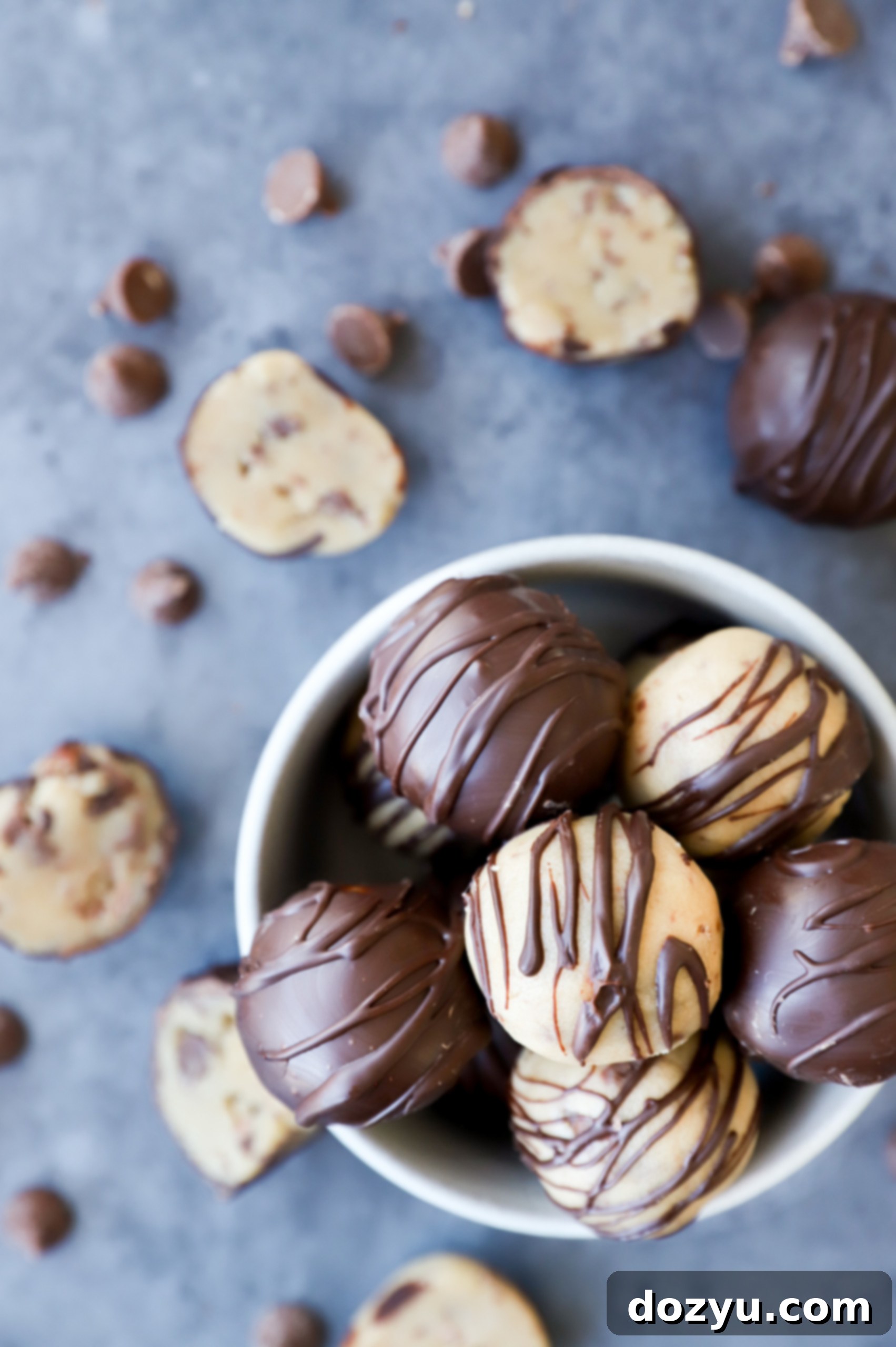 Effortless No-Bake Cookie Dough Treats 7 image of chocolate dipped truffles in a bowl