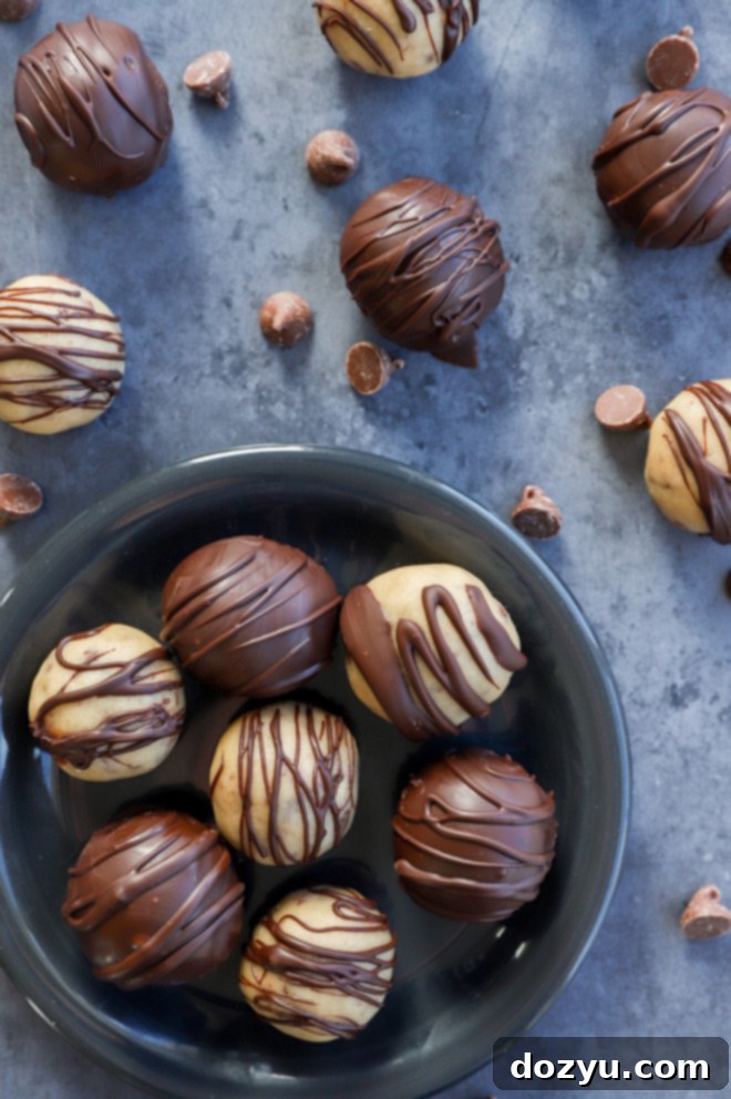 Effortless No-Bake Cookie Dough Treats 9 image of chocolate dipped truffles on plate