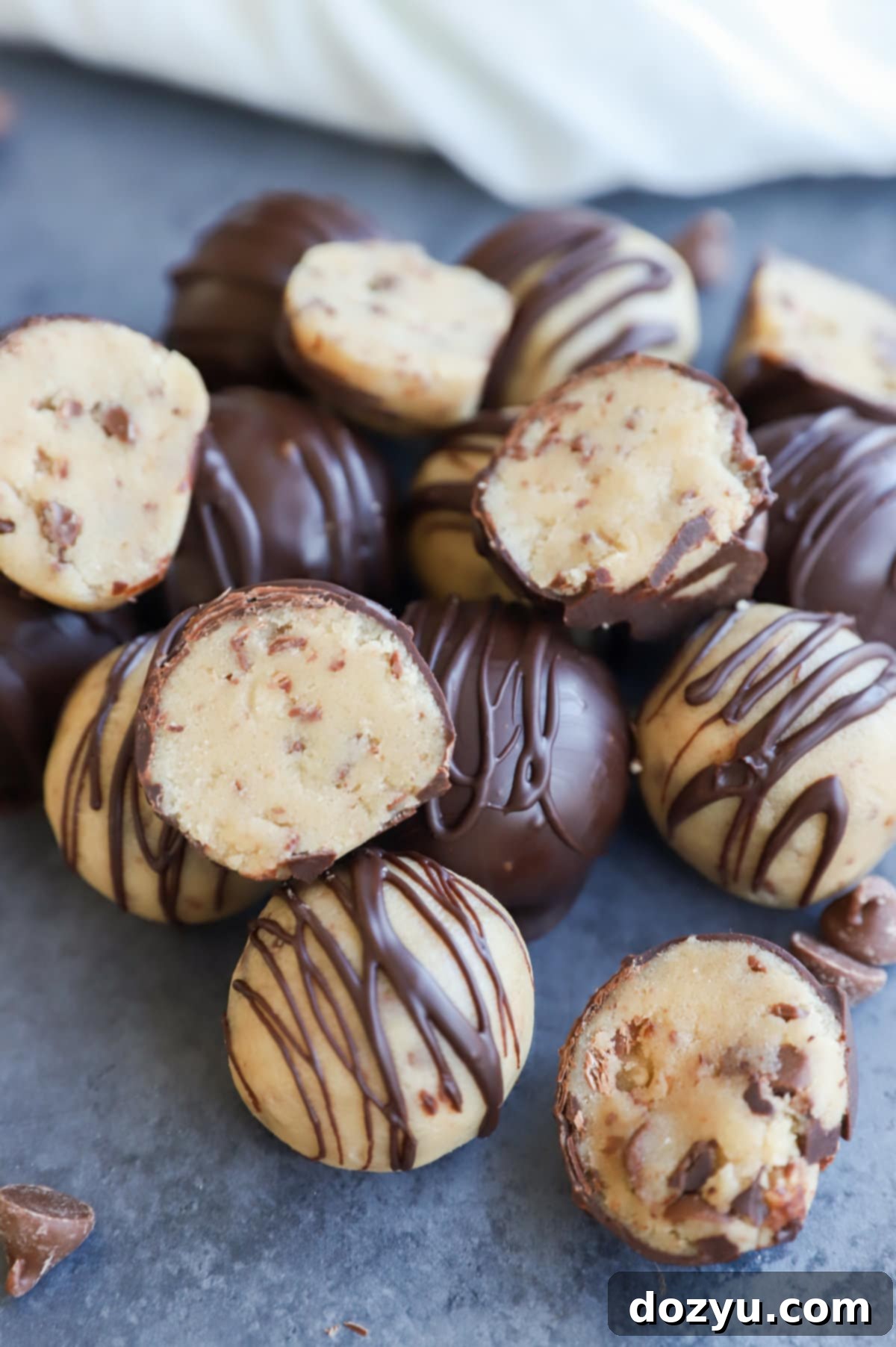 Effortless No-Bake Cookie Dough Treats 10 Cookie Dough Bites in a pile with chocolate chips picture