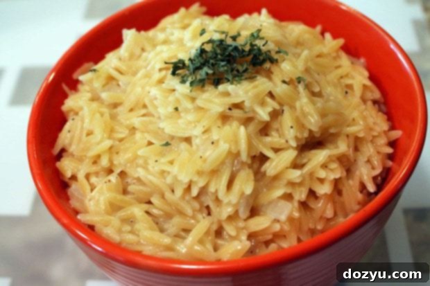 Creamy Cheesy Orzo 2 Cheesy Orzo served in a bowl, resembling mac and cheese