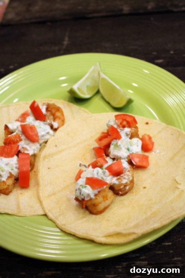 Shrimp tacos with lime cilantro crema in a serving dish