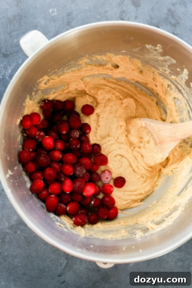 Cranberry muffin batter in a bowl.