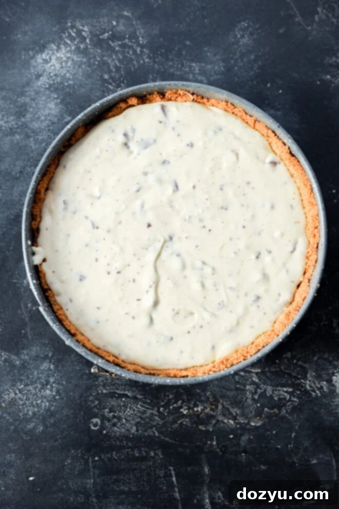 Unbaked Toblerone cheesecake with a graham cracker crust.