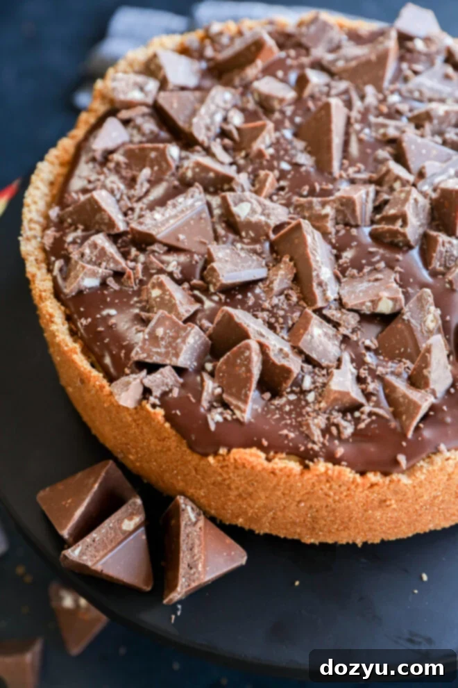 A Toblerone chocolate pie with a glossy chocolate layer.
