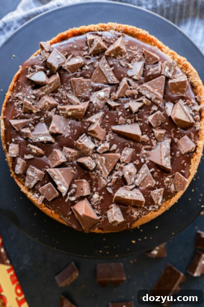 Toblerone cheesecake on a dark surface.