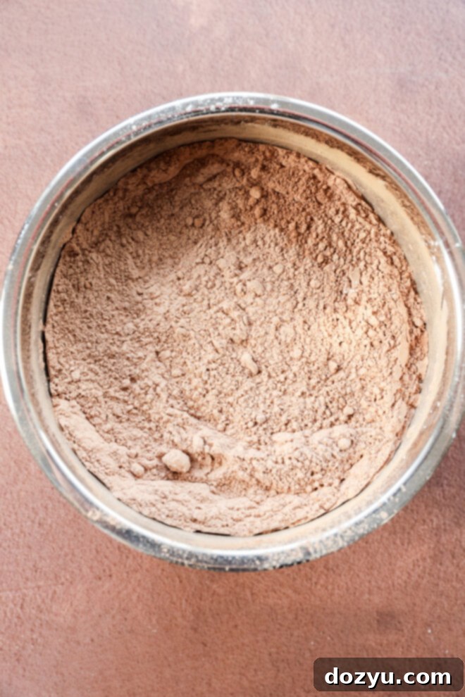 Cocoa powder in a metal bowl.