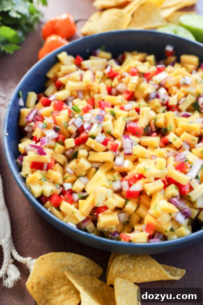 Mango habanero salsa in a blue bowl.