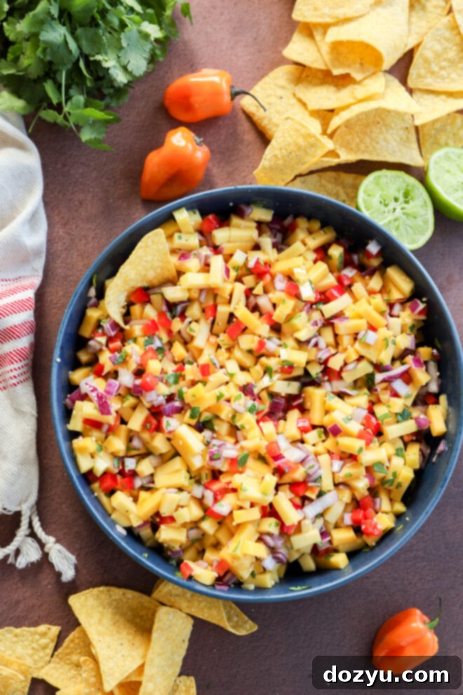 Mango habanero salsa with fresh ingredients.