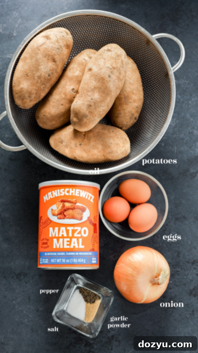 Ingredients for Jewish latkes including russet potatoes, yellow onion, eggs, matzo meal, and spices.